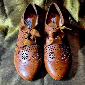 Man made upper cut-out leather look flat lace up shoe. New never worn.